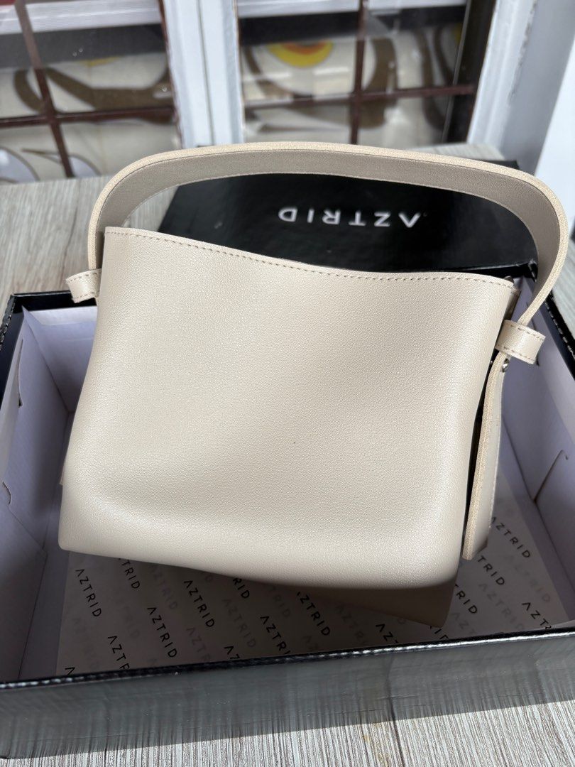 Aztrid Small Bag Crossbody Top Handle (Category: Cross-body Bags) located in Santa Rosa. Submitted by bluemingbh (Listing ID 1388727728, Image 1). Description: • brand new / never been used • color: bone • size: small • authentic mop: gcash, bdo, maya mod: lalamove or grab from sta rosa laguna or makati .