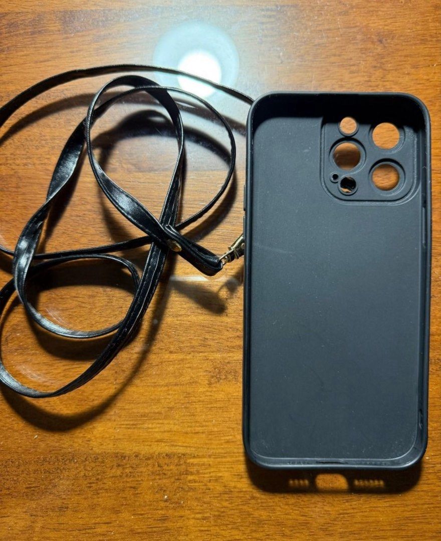 black case for iphone 14 pro max with neckstrap and pouch (Category: Cases & Sleeves) located in Manila. Submitted by jppchang96280 (Listing ID 1388889414, Image 2). Description: black case for iphone 14 pro max with neckstrap and pouch lalamove or jnt only (around metro manila preferably) buyer will shoulder shipping fee Gcash only.
