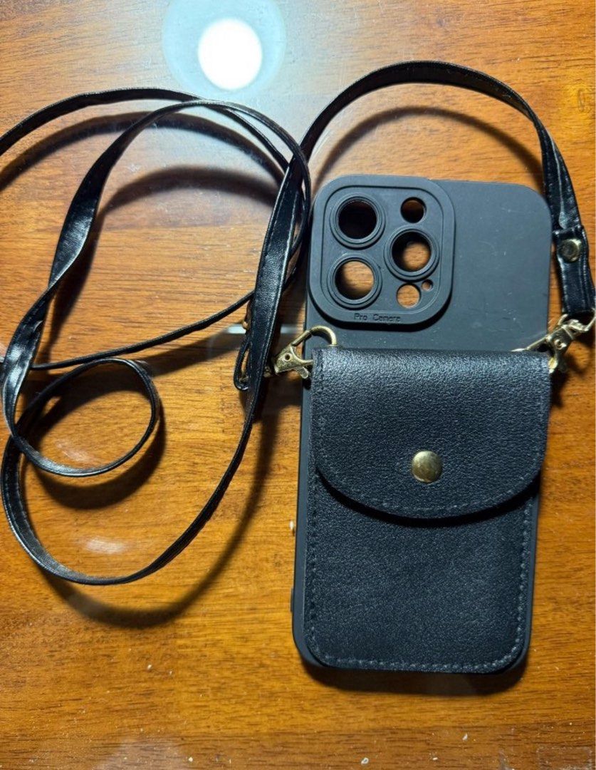 black case for iphone 14 pro max with neckstrap and pouch (Category: Cases & Sleeves) located in Manila. Submitted by jppchang96280 (Listing ID 1388889414, Image 1). Description: black case for iphone 14 pro max with neckstrap and pouch lalamove or jnt only (around metro manila preferably) buyer will shoulder shipping fee Gcash only.