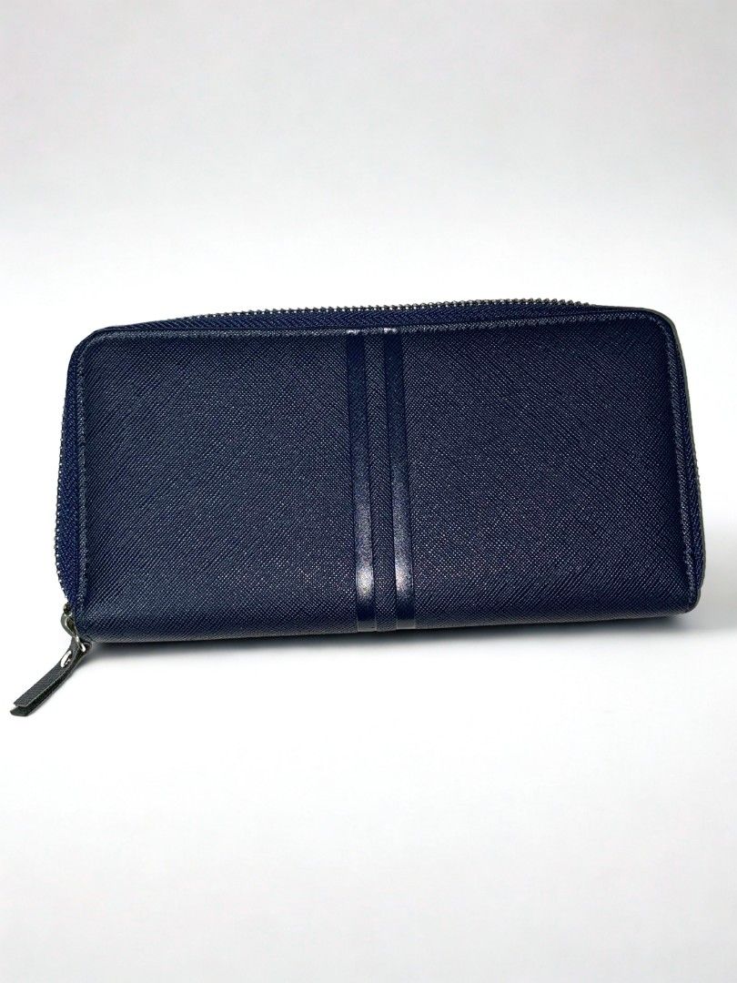 Blue Long zip Around Wallet from Miniso (Category: Purses & Pouches) located in Makati City. Submitted by micmic804 (Listing ID 1388772633, Image 1). Description: Long zip around wallet from Miniso. used only a few times..