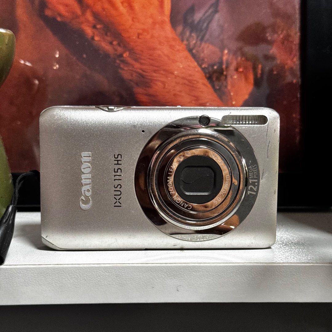 Canon Ixus 115 HS (Category: Cameras) located in Cebu City. Submitted by gilejehhk (Listing ID 1388725667, Image 1). Description: SILVER: Canon Ixus 115 HS fully functional (issue: lcd lines and vignette) pero perfect output parin!!!! -12.1 megapixel Unit, battery and universal clip charger only! .
