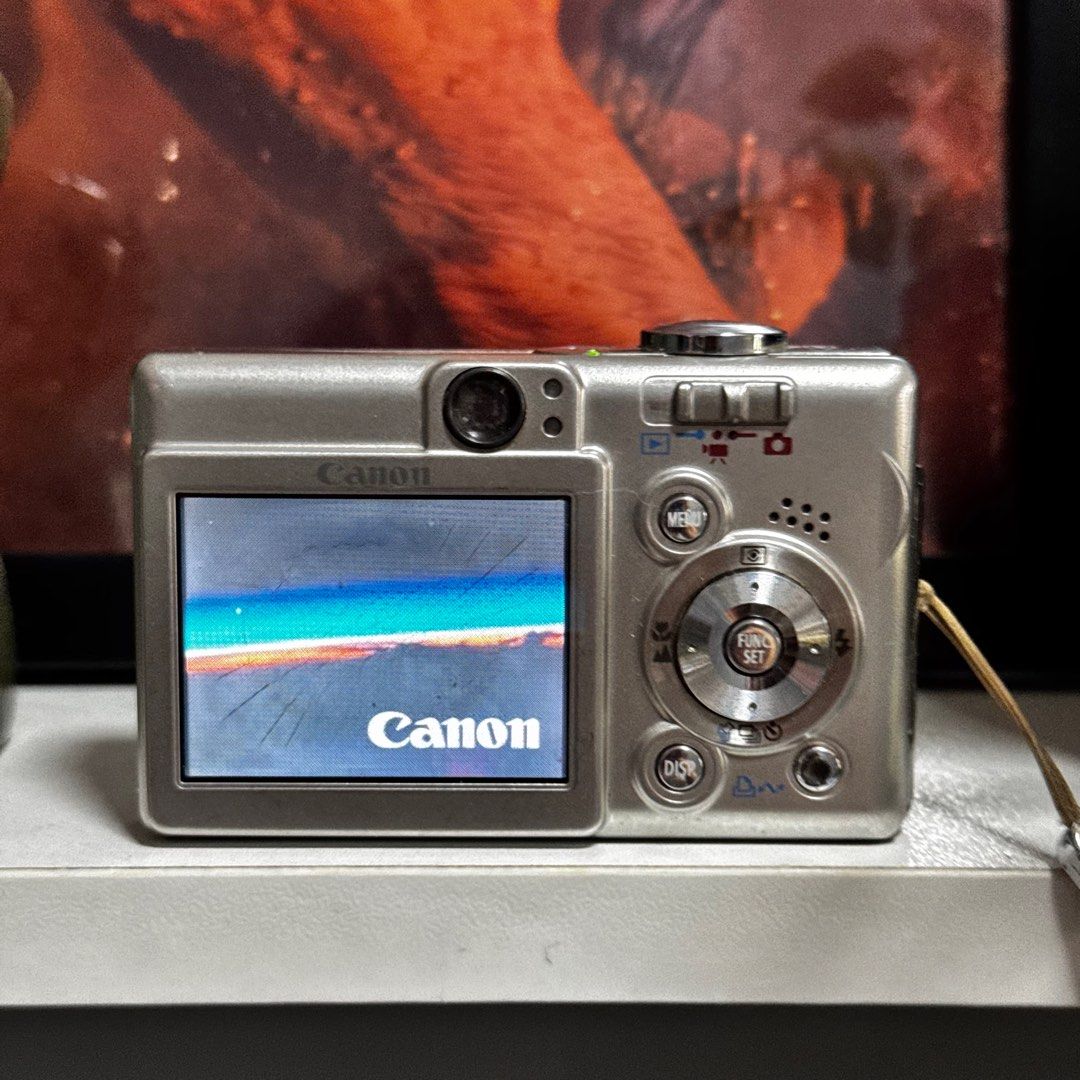 Canon Ixy Digital 50 (Category: Cameras) located in Cebu City. Submitted by gilejehhk (Listing ID 1388725354, Image 2). Description: SILVER: Canon Ixy Digital 50 fully functional (issue: lcd burn; doesn’t affect the output) -5 megapixel Unit, battery and universal clip charger only!.