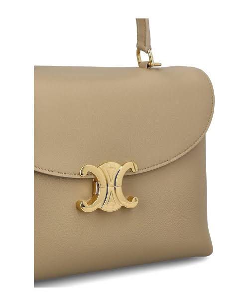 Celine Nino Capuccino Bag (Category: Luxury Bags & Wallets) located in Lipa City. Submitted by mariegaring (Listing ID 1388704018, Image 2). Description: Complete with receipt, dustbag, box, paper bag, cards, etc... 8.1 X 5.1 X 3.1 IN (20.5 X 13 X 8 CM) CALFSKIN LAMBSKIN LINING GOLD FINISHING HAND CARRY, SHOULDER CARRY AND CROSS-BODY CARRY TRIOMPHE METALLIC CLOSURE TWO MAIN COMPARTMENTS TWO INNER FLAT POCKETS ONE INNER CENTRAL ZIPPED POCKET HANDL