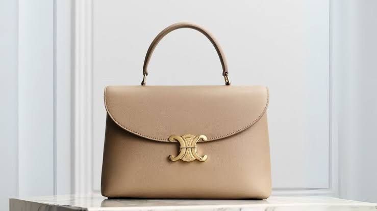 Celine Nino Capuccino Bag (Category: Luxury Bags & Wallets) located in Lipa City. Submitted by mariegaring (Listing ID 1388704018, Image 3). Description: Complete with receipt, dustbag, box, paper bag, cards, etc... 8.1 X 5.1 X 3.1 IN (20.5 X 13 X 8 CM) CALFSKIN LAMBSKIN LINING GOLD FINISHING HAND CARRY, SHOULDER CARRY AND CROSS-BODY CARRY TRIOMPHE METALLIC CLOSURE TWO MAIN COMPARTMENTS TWO INNER FLAT POCKETS ONE INNER CENTRAL ZIPPED POCKET HANDL