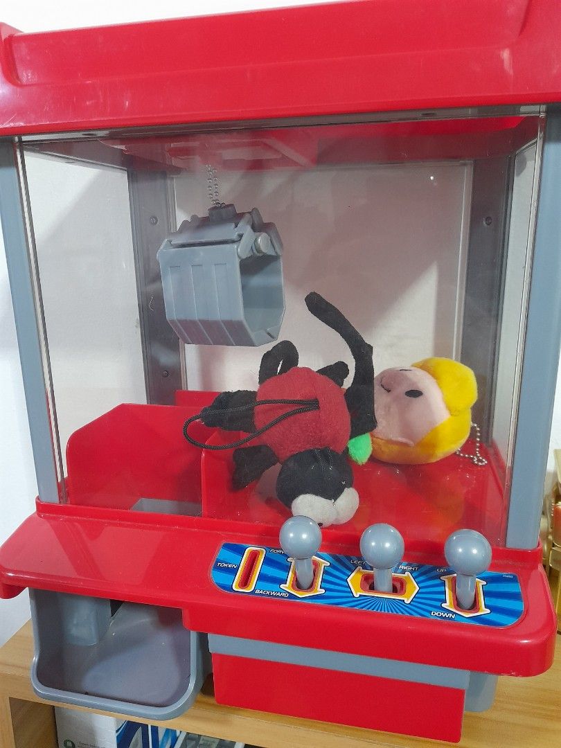 CLAW machine (Category: Interactive Toys) located in Agdangan. Submitted by csdepot (Listing ID 1388866688, Image 1). Description: Working well 12inches x 6inches (estimate) with free small stuff toys inside with token with batteries Bought from the US With FREE stuffies (4pcs) *Check images before asking pls RFS: decluttering.