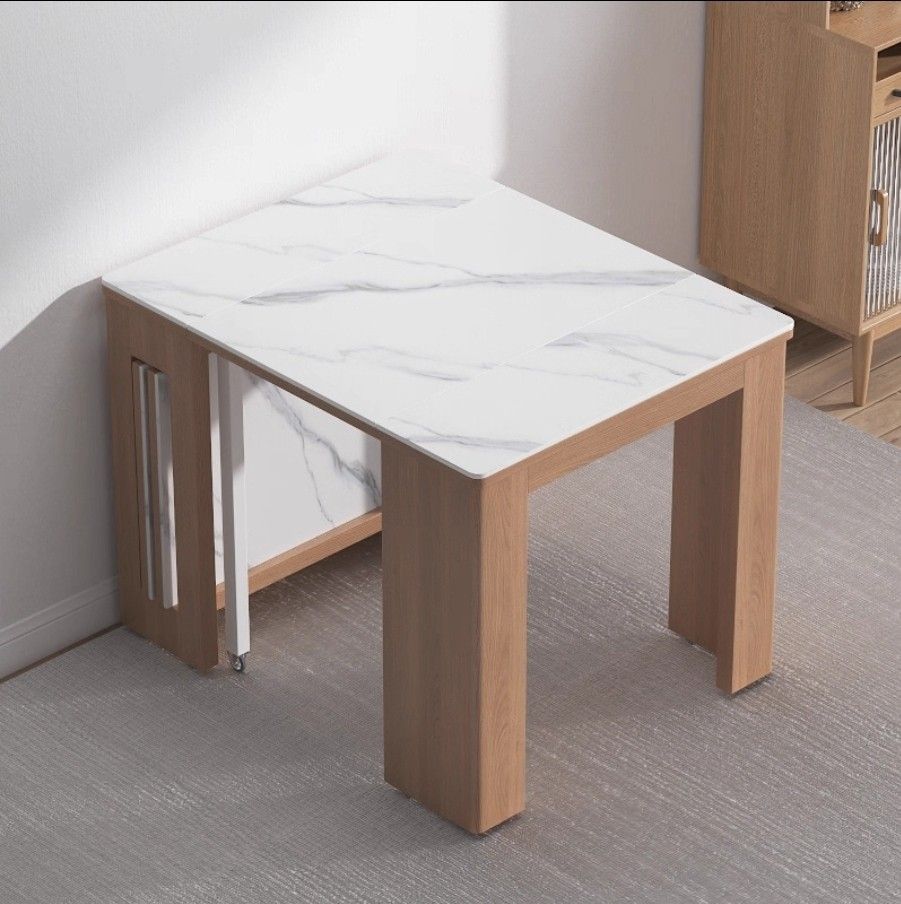 Extendable Dining Table with Stools (Category: Tables & Sets) located in Singapore. Submitted by w52weddings (Listing ID 1388745102, Image 2). Description: - Compact dining table ideal for small spaces. - Foldable for easy storage. - Extendable to fit more guests. - Comes with two stools (store under table). - Note: Small crack on the tabletop. $200 cash & carry * small crack at one of the table.