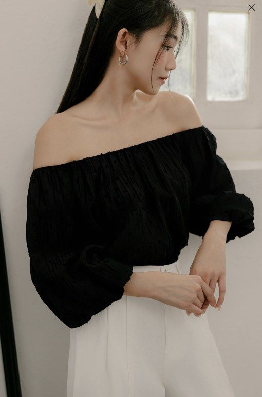Fashmob Aubree Tencel Top - Black (Category: Blouses) located in Singapore. Submitted by tatertotsx (Listing ID 1388906010, Image 1). Description: - Off-shoulder design - Swiss dotted embroidered details - Pleated, textured fabric - Babydoll flare cut - Puffed sleeves with elastic bubble hems - Fully lined - Can be worn on or off the shoulder.