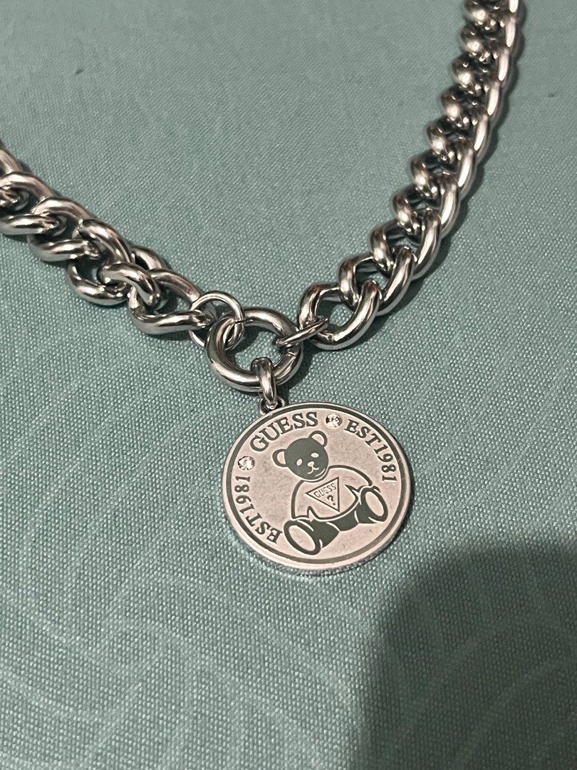 GUESS Silver Vintage Bear Chain Necklace (Category: Necklaces) located in Muntinlupa City. Submitted by jnprvbcr (Listing ID 1388764636, Image 2). Description: - authentic GUESS necklace - good condition, no fading or tarnishing - comes with a pouch - has a weight to it - comes with a mini dust bag .