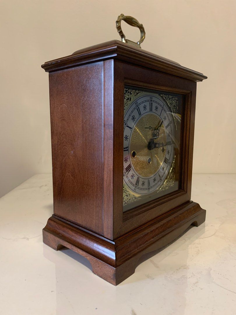 Howard Miller Bracket Mantel Clock - Made in USA (Category: Clocks) located in Mandaluyong City. Submitted by aljayy (Listing ID 1388745158, Image 2). Description: Excellent condition Beautiful westminster chime Finished in Windsor Cherry on select hardwoods and veneers. Brass finished dial offers a silver chapter ring and decorative corner spandrels. A high-precision, German-made, key-wound, Westminster chime movement plays 1/4, 1/2, and 3/4 chi