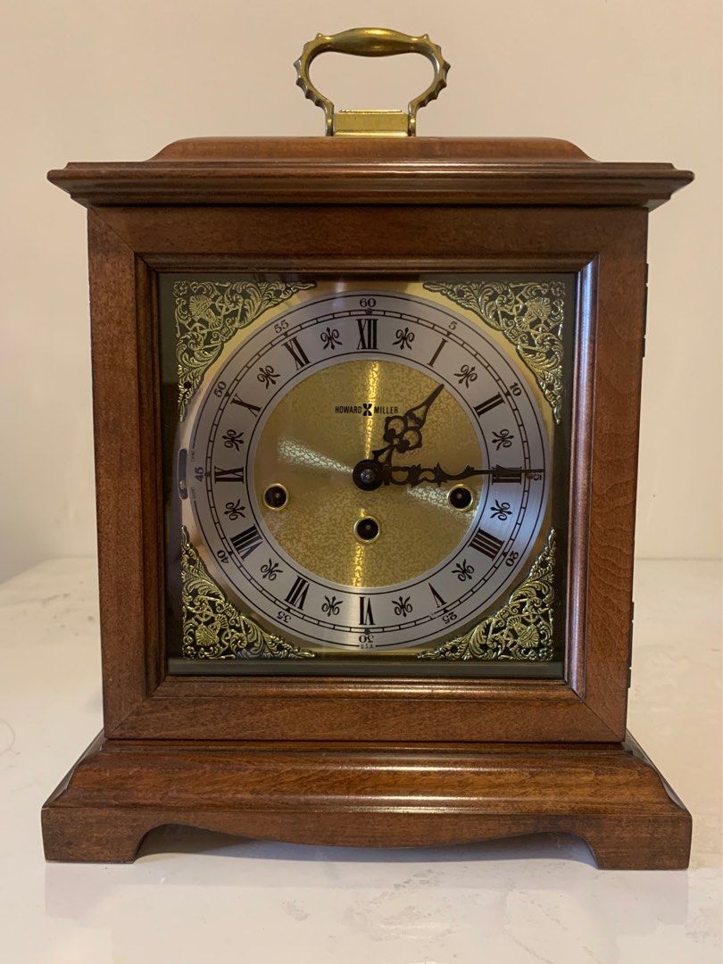 Howard Miller Bracket Mantel Clock - Made in USA (Category: Clocks) located in Mandaluyong City. Submitted by aljayy (Listing ID 1388745158, Image 1). Description: Excellent condition Beautiful westminster chime Finished in Windsor Cherry on select hardwoods and veneers. Brass finished dial offers a silver chapter ring and decorative corner spandrels. A high-precision, German-made, key-wound, Westminster chime movement plays 1/4, 1/2, and 3/4 chi