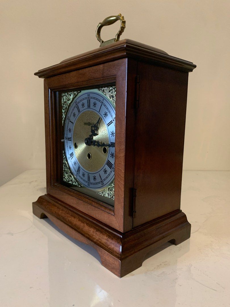 Howard Miller Bracket Mantel Clock - Made in USA (Category: Clocks) located in Mandaluyong City. Submitted by aljayy (Listing ID 1388745158, Image 3). Description: Excellent condition Beautiful westminster chime Finished in Windsor Cherry on select hardwoods and veneers. Brass finished dial offers a silver chapter ring and decorative corner spandrels. A high-precision, German-made, key-wound, Westminster chime movement plays 1/4, 1/2, and 3/4 chi