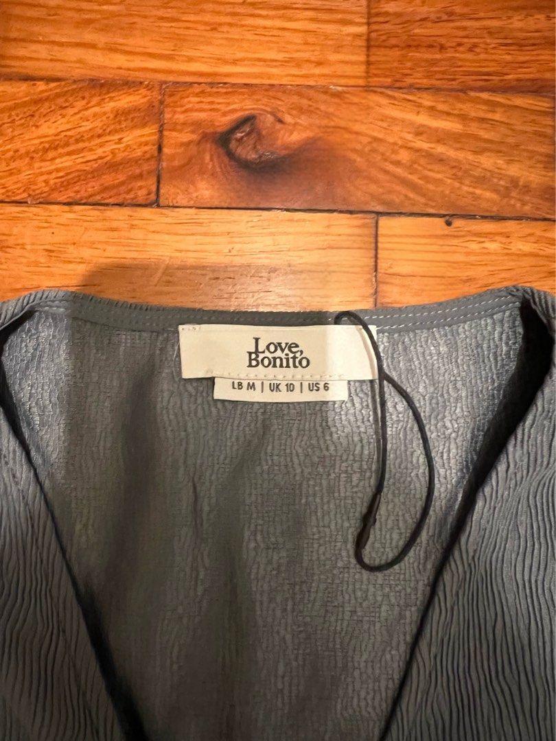 Love Bonito mini wrap dress (Category: Dresses) located in Paranaque City. Submitted by pattyaurel (Listing ID 1388791603, Image 2). Description: Love Bonito grey mini wrap dress, never been used but no more paper tag. .