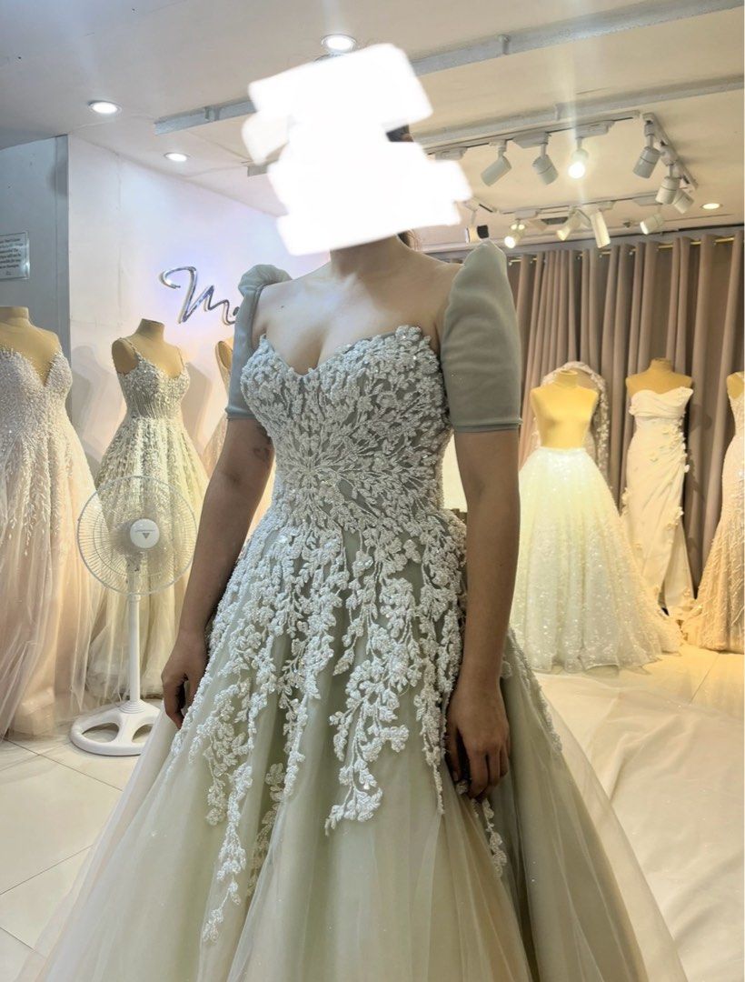 Mark Bride’s Manila wedding gown (Category: Evening dresses & gowns) located in Paranaque City. Submitted by yourcatseller (Listing ID 1388841194, Image 1). Description: Selling my Mark Bride’s Manila gown. Used once last August 2024. Includes: Gown with detachable sleeves (white and green ombre color) Primary veil Box Price 120 now only 30 Issue: for dry cleaning again Medium size Waist 28 Height 5'4 (+ 2 inches heels) Loc: Paranaque.