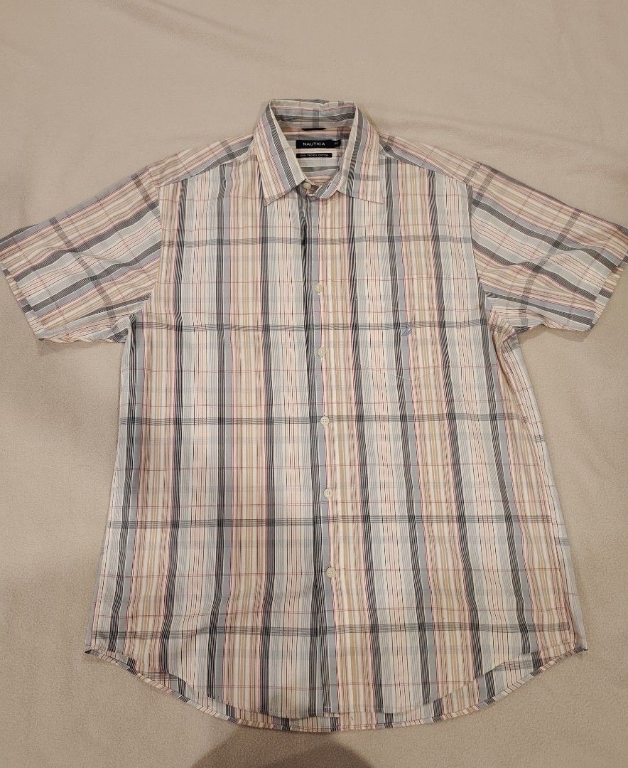 Nautica Short Sleeve Polo (Category: Formal Shirts) located in Makati City. Submitted by mrky88 (Listing ID 1388831828, Image 1). Description: Nautica Short Sleeve Polo Size : Medium Length : 27.5 Inches Width : 22 Inches Shoulder : 18.5 Inches.