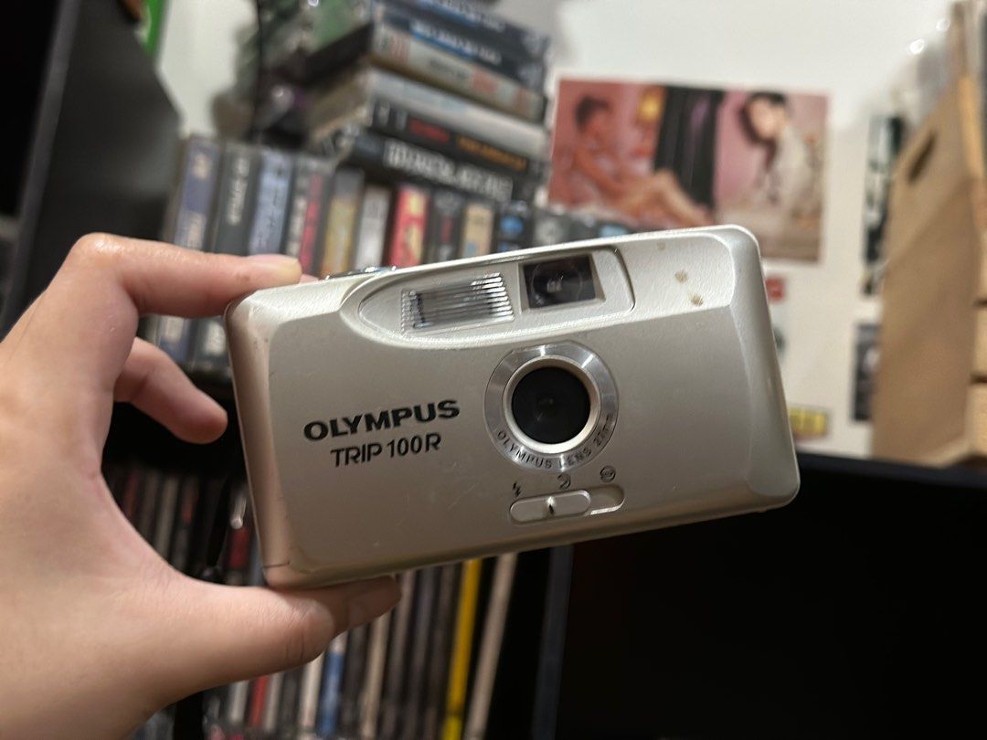 OLYMPUS TRIP 100R POINT AND SHOOT CAMERA VINTAGE CAMERA (Category: Cameras) located in Marikina City. Submitted by GsauceFriesRcrds30 (Listing ID 1388727159, Image 1). Description: OLYMPUS TRIP 100R - Visible Scratch on the body and the hook that supposed to keep it close is broken but doesn’t affect the pictures results. - Type: Snapshot camera - Type of Film: 35mm - Focal length: 27mm - Maximum aperture: f/8 - Works Including it’s flash - Batte