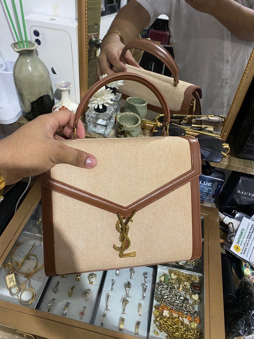 YSL Cassandra top handle bag (Category: Luxury Bags & Wallets) located in Manila. Submitted by bvd9dwnrgf23014 (Listing ID 1388704243, Image 1). Description: YSL Cassandra top handle bag Calfskin leather with canvas All signs of authenticity is in the bag Coded.