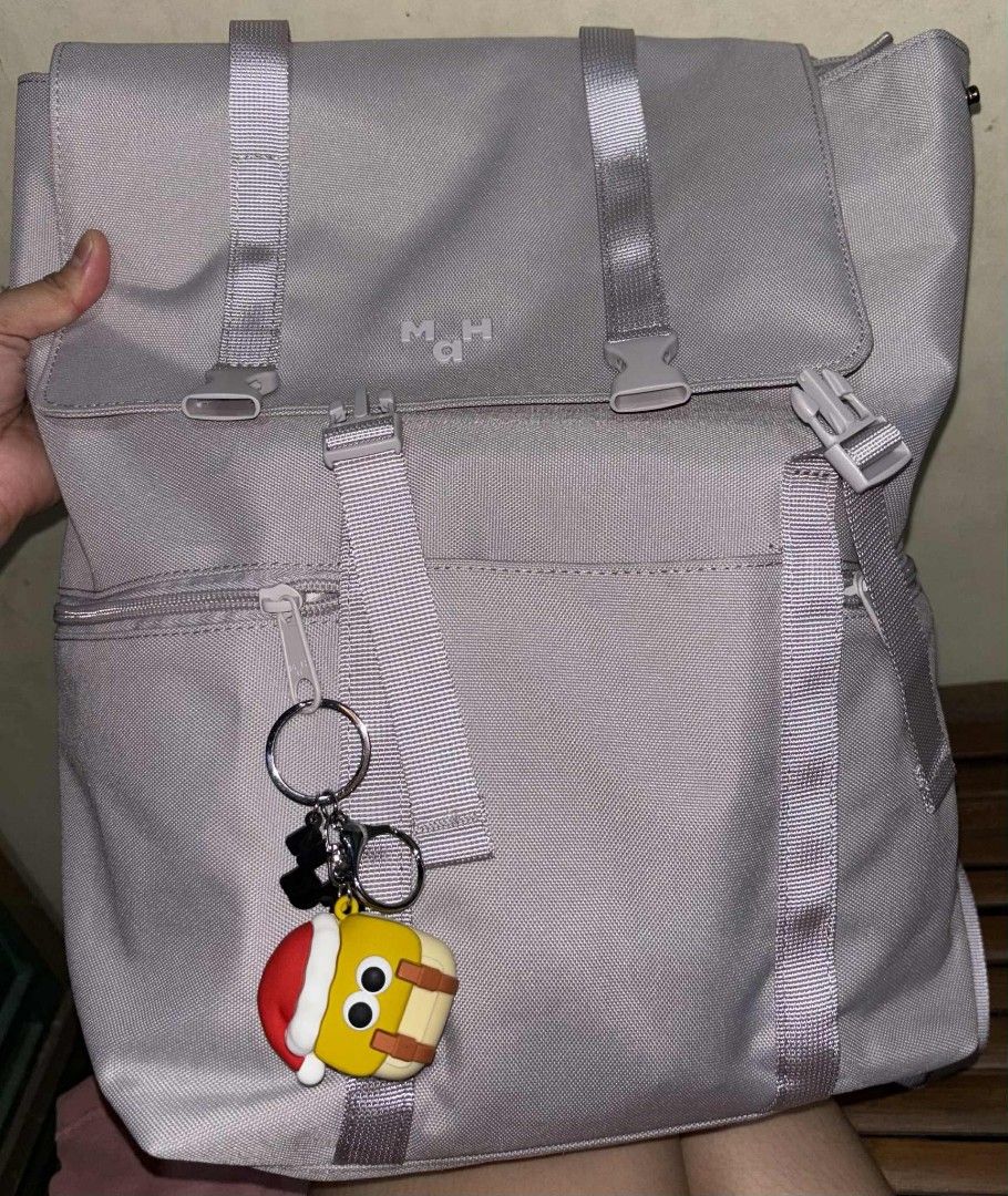 Backpack (Category: Backpacks) located in Bulacan. Submitted by jhe_anne (Listing ID 1389078800, Image 3). Description: MAH Backpack Waterproof Fabric Size: 26.5*11*37cm Color: Lilac Kasya 14" laptop, umbrella, tumbler, etc. Madaming compartment kita naman sa pictures. Not included yung keychain RFS: Need magpalit ng bag.