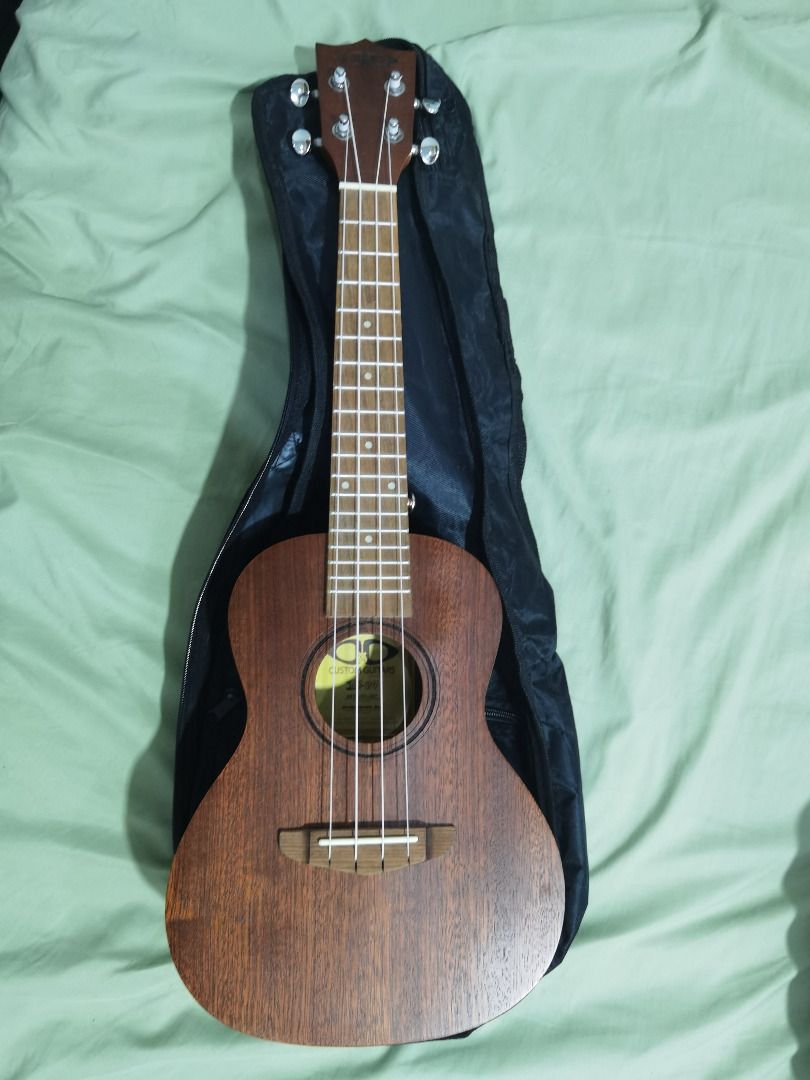 D&D Ukulele 24 (Category: Musical Instruments) located in Manila. Submitted by cheebsecake (Listing ID 1389040660, Image 1). Description: D&D 24 Ukulele with bag - receipt is in the photos - body is in excellent condition - used for a few hours then put in storage - strings are stock from original purchase .