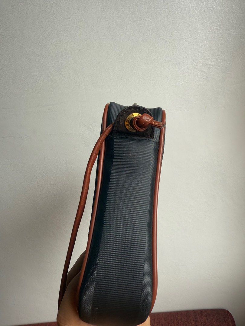 FENDI Vintage Sling Bag (Category: Luxury Bags & Wallets) located in Marikina City. Submitted by jarediniiiee (Listing ID 1389002577, Image 3). Description: This is vintage bag, please manage your expectations. Comes with dust bag Height: 17cm Width 23cm Gusset 5cm Shoulder 117.5cm Flaws: leather lining repainted already.