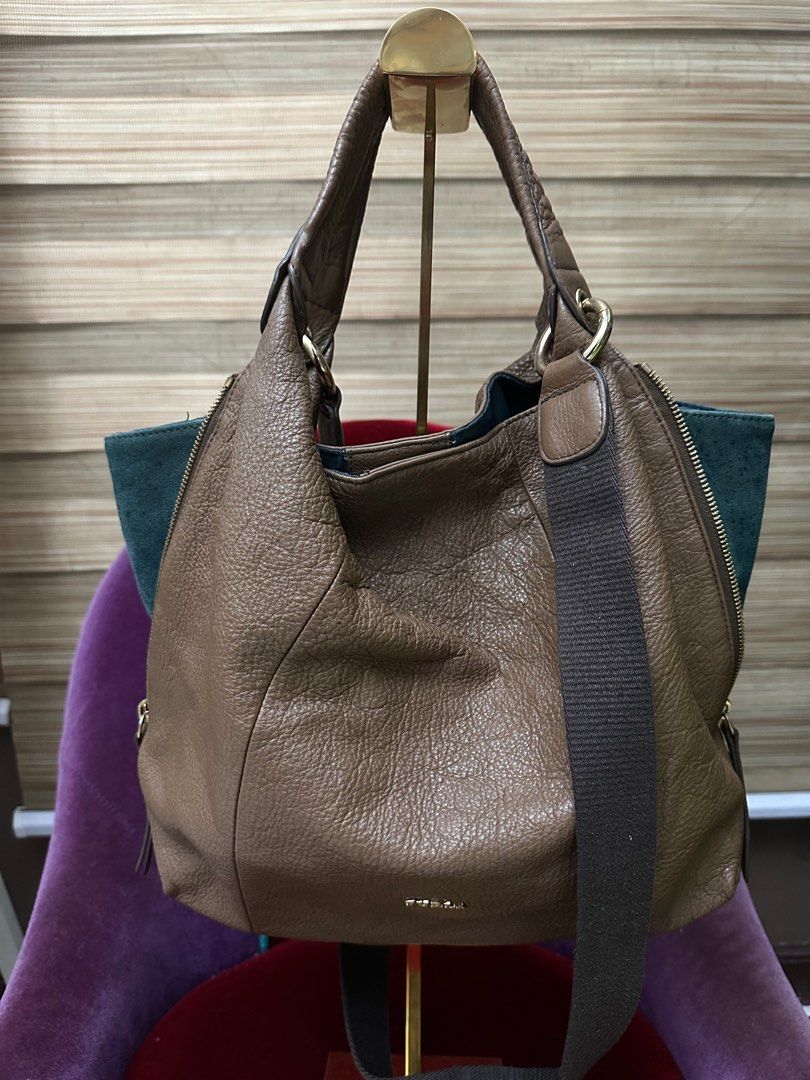 Furla Hobo Bag (Category: Tote Bags) located in Pasig City. Submitted by fashionalternatives (Listing ID 1389049267, Image 3). Description: Preloved Furla Two Way Bag Hobo with strap Grained leather with sign of use since its preloved .
