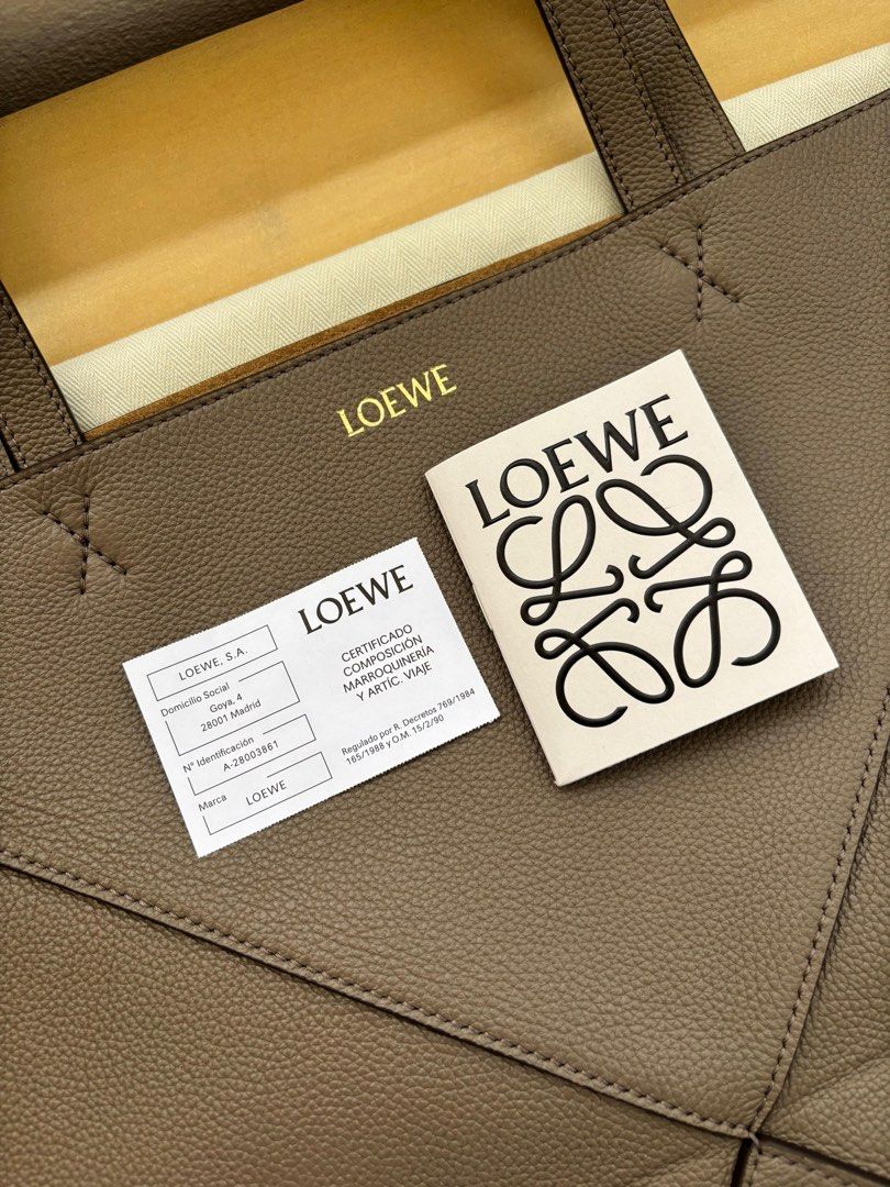 Loewe Medium Puzzle Fold Tote (Category: Luxury Bags & Wallets) located in Mandaluyong City. Submitted by margabell (Listing ID 1388960299, Image 3). Description: For Sale Brand New Loewe Medium Puzzle Fold Tote Soft Grained Calf Skin (Non-Shiny Leather) Taupe Color Complete Inclusions such as Authentication Certificate & Dust Bag Bought in the United Kingdom (UK) .