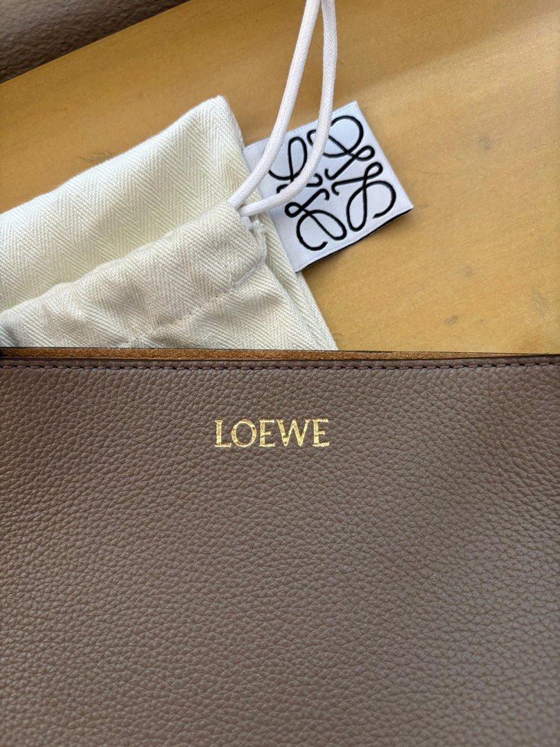 Loewe Medium Puzzle Fold Tote (Category: Luxury Bags & Wallets) located in Mandaluyong City. Submitted by margabell (Listing ID 1388960299, Image 2). Description: For Sale Brand New Loewe Medium Puzzle Fold Tote Soft Grained Calf Skin (Non-Shiny Leather) Taupe Color Complete Inclusions such as Authentication Certificate & Dust Bag Bought in the United Kingdom (UK) .