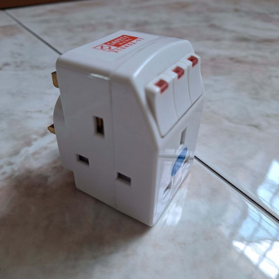 Multi-Plug Adapter (Category: Cables & Adaptors) located in Singapore. Submitted by 12deal (Listing ID 1389008676, Image 2). Description: - 3way multi-plug adapter, good quality with safety marks and LED lights. - Individual switches for each outlet 2pcs for $12.00 .