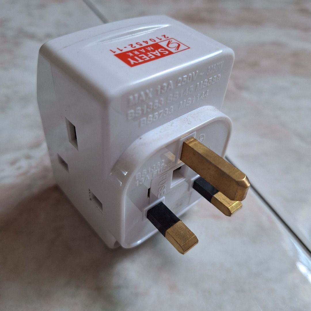 Multi-Plug Adapter (Category: Cables & Adaptors) located in Singapore. Submitted by 12deal (Listing ID 1389008676, Image 3). Description: - 3way multi-plug adapter, good quality with safety marks and LED lights. - Individual switches for each outlet 2pcs for $12.00 .