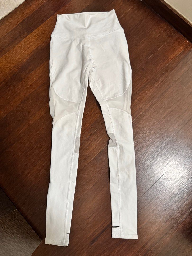 Alo Yoga White Leggings - XS (Category: Activewear) located in Singapore. Submitted by Emmacute2233 (Listing ID 1389232976, Image 1). Description: - Alo Yoga leggings in excellent condition - White with mesh detailing - Size: XS - High-waist design - Stirrup detail at ankles - Suitable for yoga and everyday wear.