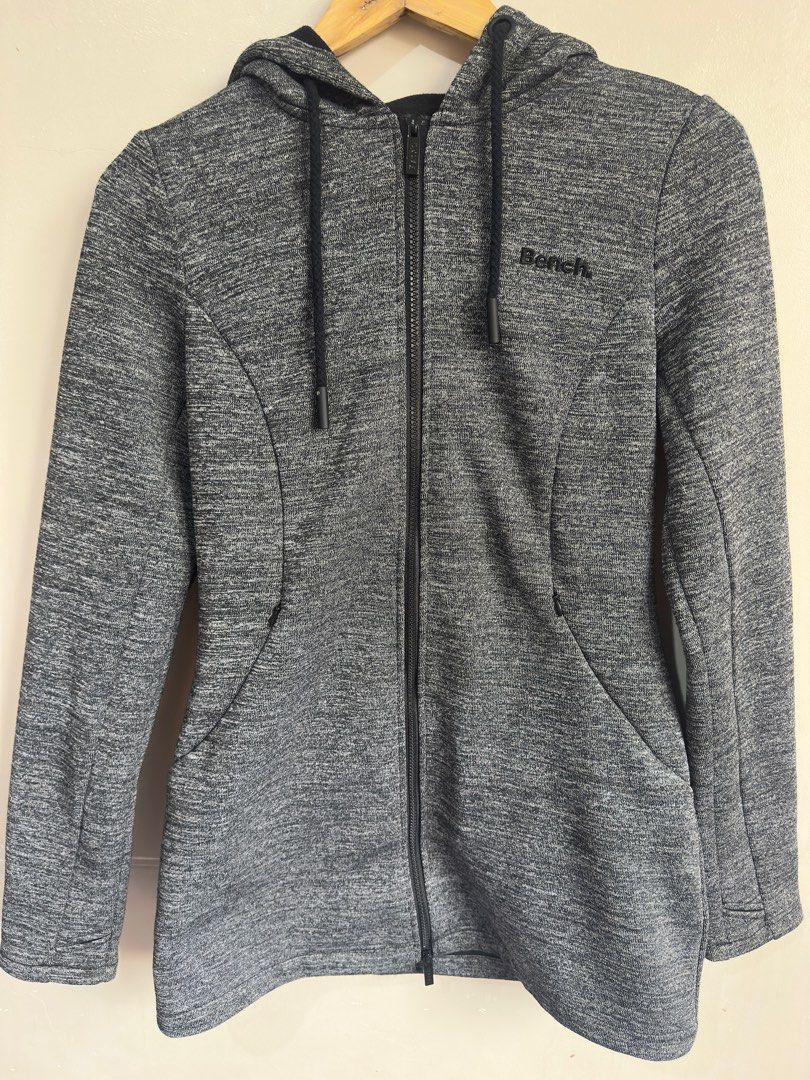 Bench. Jacket Unisex (Category: Coats, Jackets and Outerwear) located in San Pedro. Submitted by yard_space (Listing ID 1389293570, Image 2). Description: Bench. Jacket Unisex - Size: M - EU: 38 - US: 8 2 Zippers, Pockets w/ Zippers, Hoodie, Thumb holes to keep your palms warm A gift from a relative from Canada, but it doesn't really fit me(I'm an XL male FYI) and I'm not really into jackets, plus it's thick. Was never used, this was in my wardro