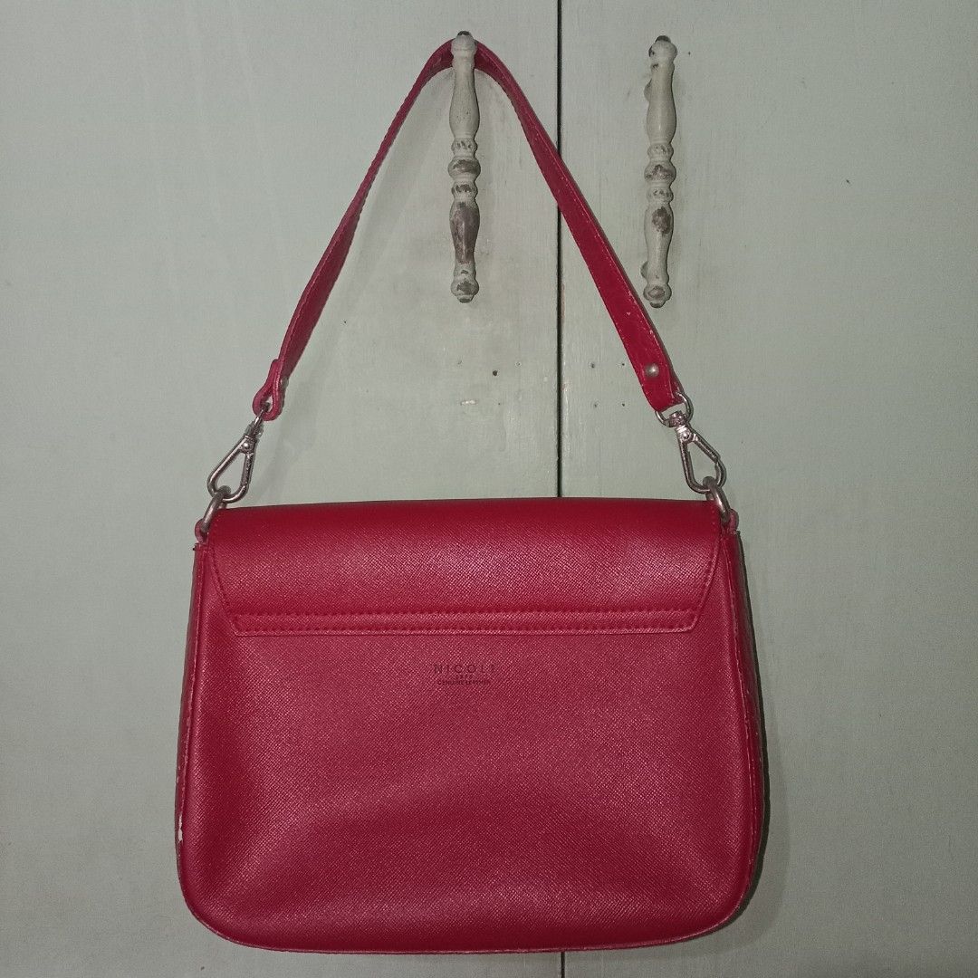 Kili bag Red Genuine Leather (Category: Shoulder Bags) located in Manila. Submitted by 90ninety (Listing ID 1389173107, Image 2). Description: SUPERSALE From Paris! Brand: NICOLI Genuine Leather Honest Issue (see last 2 pics): May red nail polish (removable) underneath, may kaunting flakes yung handle.