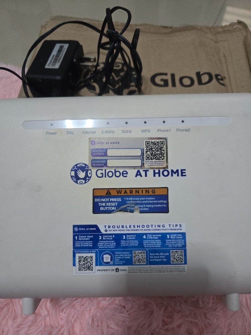 Globe At Home WiFi Modem Router with Adapter (Category: Other Accessories) located in Makati City. Submitted by hellovallieee (Listing ID 1389330336, Image 3). Description: Globe At Home wifi modem router with adapter has 2 phone lines has 4 LAN sockets rfs: canceled my subscription.