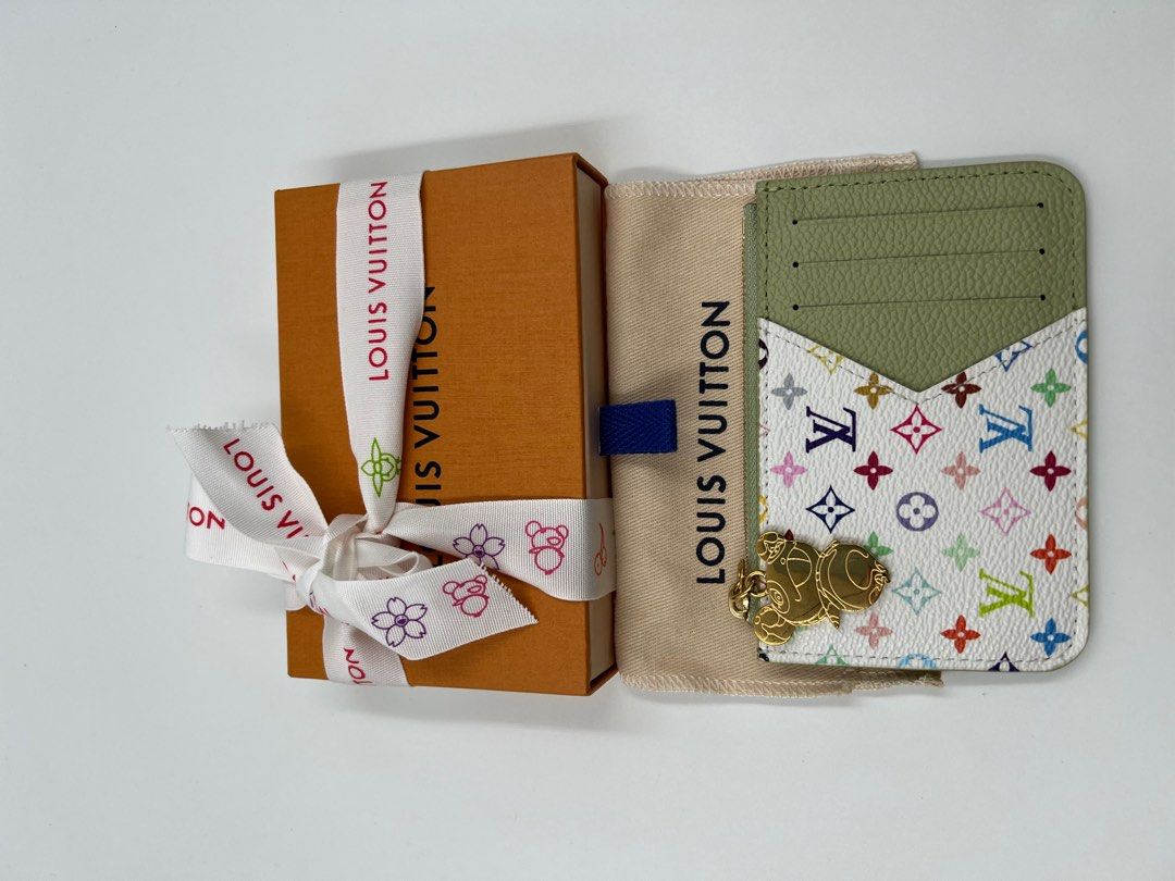 ⚜️LV x Murakami wallet / cardholder (Category: Luxury Accessories) located in Makati City. Submitted by 90sangel (Listing ID 1389480050, Image 3). Description: •Item: LV ~ ft. multiple cardslots💳🪪 microchipped *a fresh seasonal shade from the Louis Vuitton x Murakami collection, complete with a glimpse of a multicolored Monogram •Condition: Brand New Sample piece. Japan purchased. *This includes the original box, dustbag, 🍑🧡paperbag, receipt 