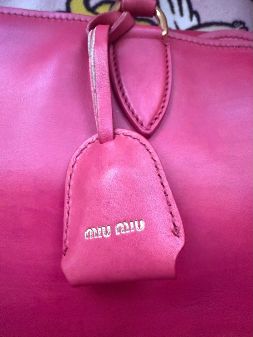 Miu Miu (Category: Luxury Bags & Wallets) located in Mercedes. Submitted by ddshoping238309 (Listing ID 1389328537, Image 3). Description: Good used condition With 3 compartment With discolorations Large size raspberry color Clochette with keys Strap Normal signs of use Hardwares still shiny with minimal scratches .