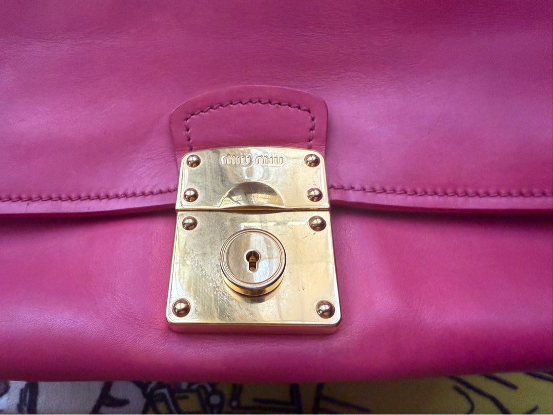 Miu Miu (Category: Luxury Bags & Wallets) located in Mercedes. Submitted by ddshoping238309 (Listing ID 1389328537, Image 2). Description: Good used condition With 3 compartment With discolorations Large size raspberry color Clochette with keys Strap Normal signs of use Hardwares still shiny with minimal scratches .