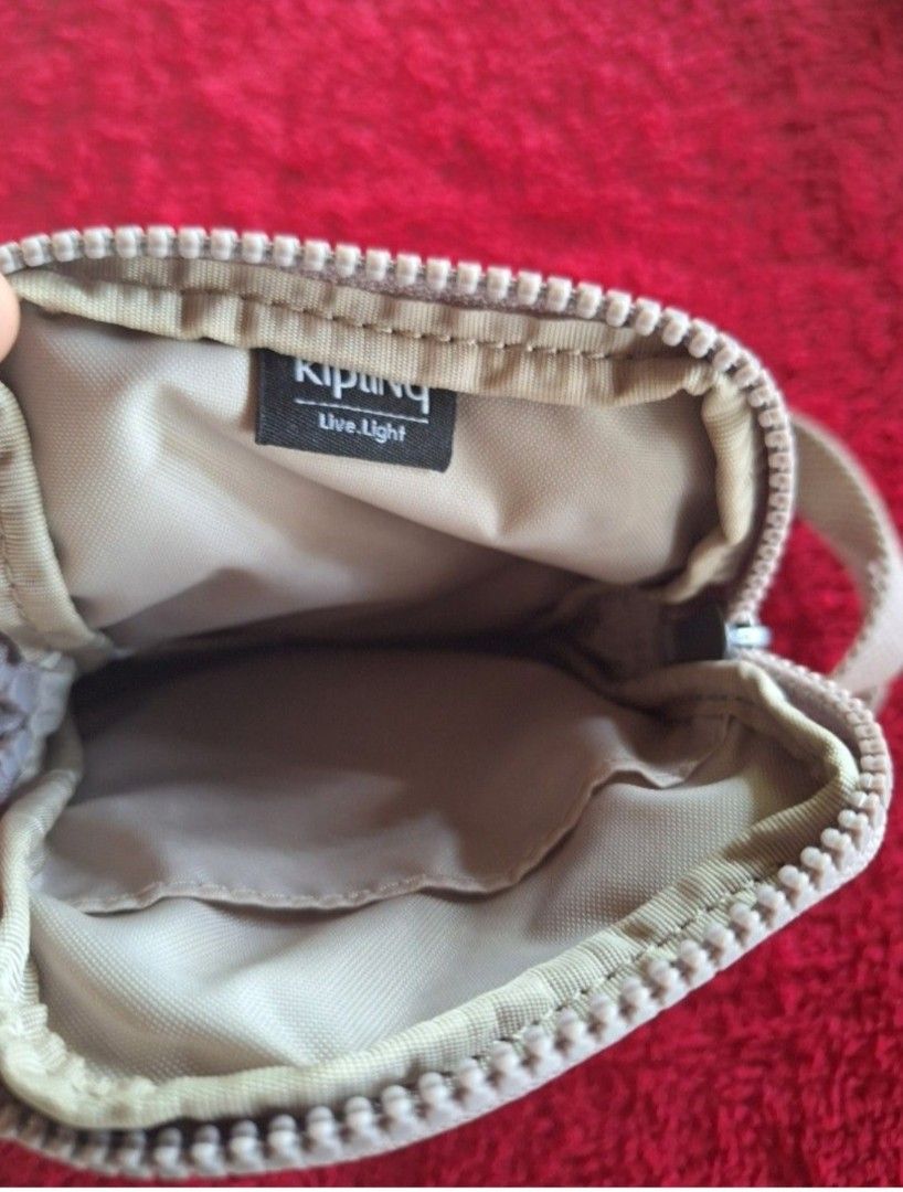 KIPLING CROSS BODY BAG/PHONE BAG (Category: Cross-body Bags) located in Batac City. Submitted by thedecluttrcat.in (Listing ID 1389512519, Image 2). Description: KIPLING Phone Bag Hazelnut Metallic Original Malinis ang loob at labas May inner and outer pocket From US Pwede din for bills and coins 800 pesos only Price is fixed plus sf Payment thru GCASH. Payment first before I send the item. No to COD/COP Shipping fee will be shouldered by the buy