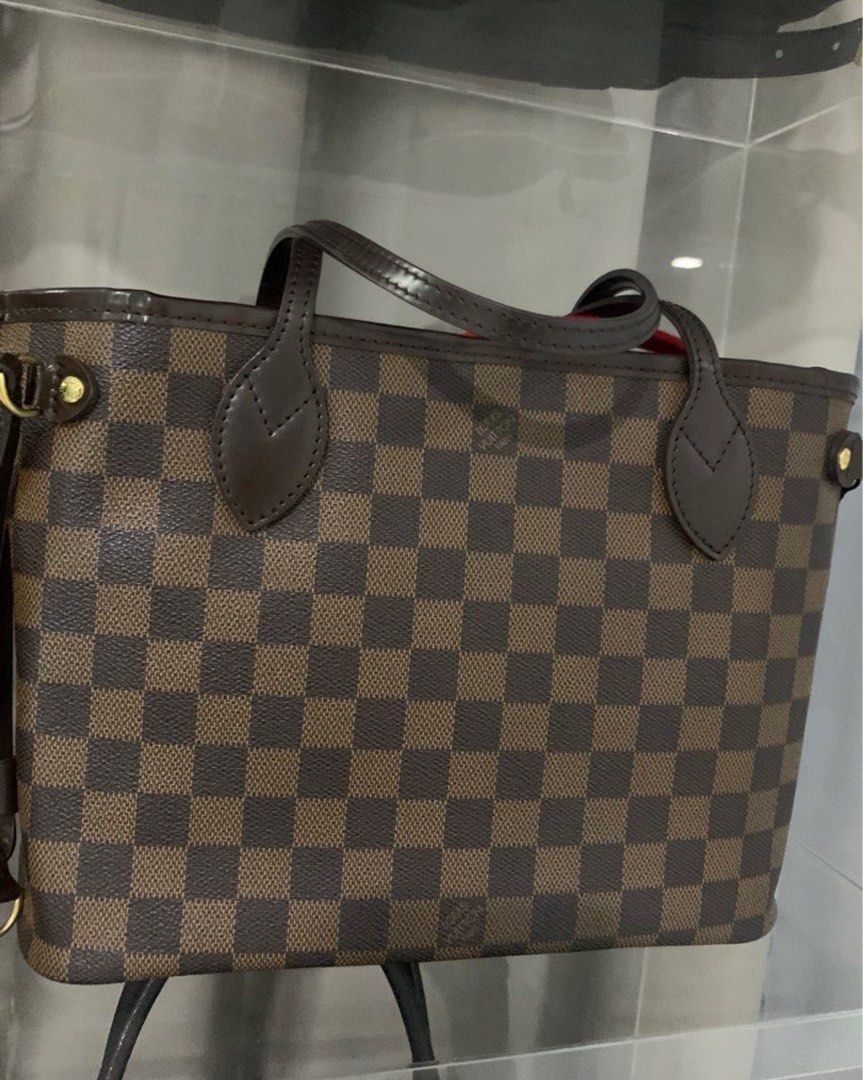 LOUIS VUITTON NEVERFULL EBENE DAMIER PM (Category: Luxury Bags & Wallets) located in Manila. Submitted by decluterthings888 (Listing ID 1389658255, Image 1). Description: PM SIZE RANK A BAG ONLY & DUST BAG ONLY no pouch JAPAN everyday bag LV .