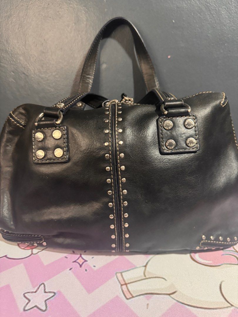 OG MK Vintage bag (Category: Luxury Bags & Wallets) located in Cavite. Submitted by lumi5 (Listing ID 1389598742, Image 3). Description: Original MK Vintage bag Issue - inside only (see photos) discoloration sa tela at tastas ang gilid genuine leather +sf Unionbank, gcash From Bacoor, Cavite.