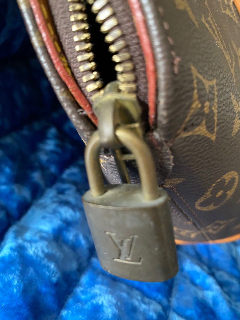 LOUIS VUITTON ELLIPSE MONOGRAM PM VINTAGE (Category: Luxury Bags & Wallets) located in Makati City. Submitted by celebrityauctions (Listing ID 1389492446, Image 3). Description: This is a Louis Vuitton Ellipse Monogram handbag heavily used but no missing part n still strong. Heavily used and there is no serial number. Very clean iinterior. Description: Shape: The bag features a distinctive elliptical or dome-shaped silhouette. Material: It is cra