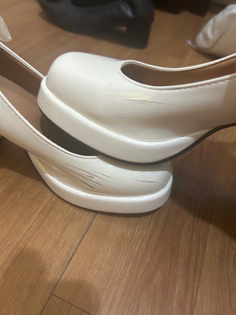 white high heels (for concert/wedding) (Category: Heels) located in Manila. Submitted by oerbiting (Listing ID 1389526872, Image 2). Description: used once for a concert, visible scratch marks seen in second photo heel height: ~4 inches.