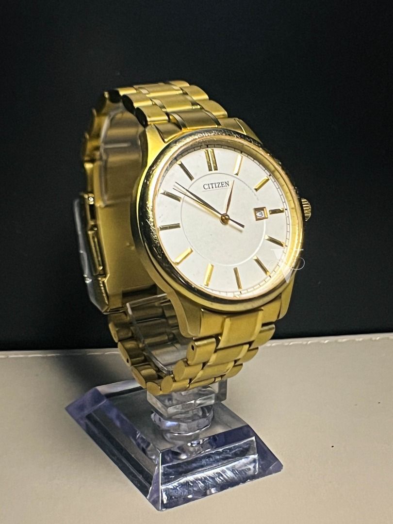 Citizen BI1052-51A (Category: Luxury Watches) located in Quezon City. Submitted by vrwatchclub (Listing ID 1384439848, Image 3). Description: Citizen BI1052-51A has that dressy yet versatile look without breaking the bank. Brand: Citizen (Pre-loved) Model: BI1052-51A Movement: Quartz (Analog) Dial: White, Round Date Window at 3 o’clock Case Width: 40mm Dial Size: ~38mm Glass: Hardlex Crystal Case & Band Color: Gold Case & Band Material: Stainless
