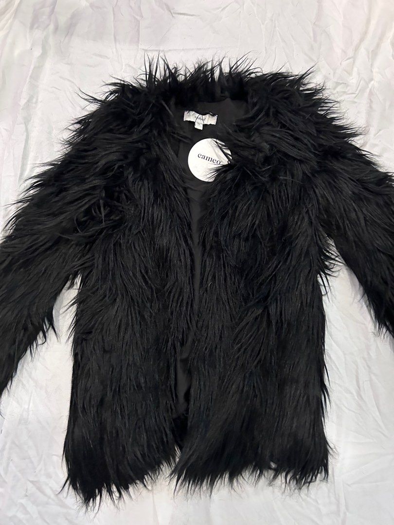 C/Meo collective ‘magnetic fur’ coat (Category: Women's Clothes) located in Melbourne. Submitted by emwright (Listing ID 1384499093, Image 3). Description: C/meo, formerly Cameo the label, ‘magnetic fur’ coat, size XS Stunning faux fur style black coat. Slimline colarless silhouette, finishes top of thigh. Brand new with tag.
