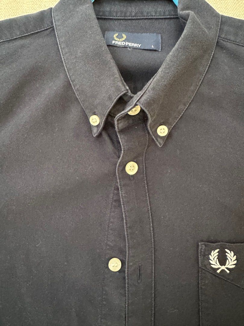 Fred Perry Short Sleeves Polo Button-Down (Category: Tshirts & Polo Shirts ) located in Muntinlupa City. Submitted by king_declutter (Listing ID 1384441865, Image 3). Description: For Sale: Authentic Fred Perry Short Sleeves Polo Color: Navy Blue Condition: 9/10 Size: Large RFS: Decluttering Price: 2.5k .