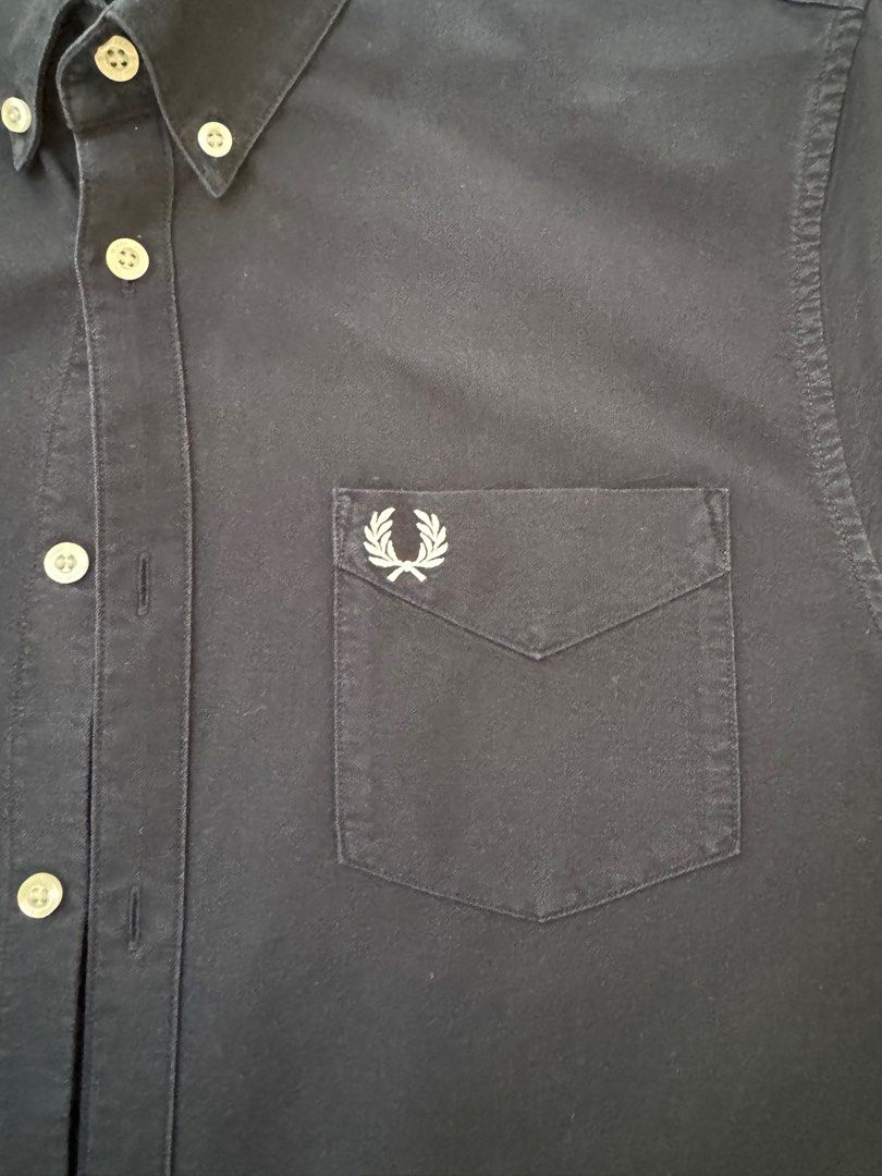 Fred Perry Short Sleeves Polo Button-Down (Category: Tshirts & Polo Shirts ) located in Muntinlupa City. Submitted by king_declutter (Listing ID 1384441865, Image 2). Description: For Sale: Authentic Fred Perry Short Sleeves Polo Color: Navy Blue Condition: 9/10 Size: Large RFS: Decluttering Price: 2.5k .