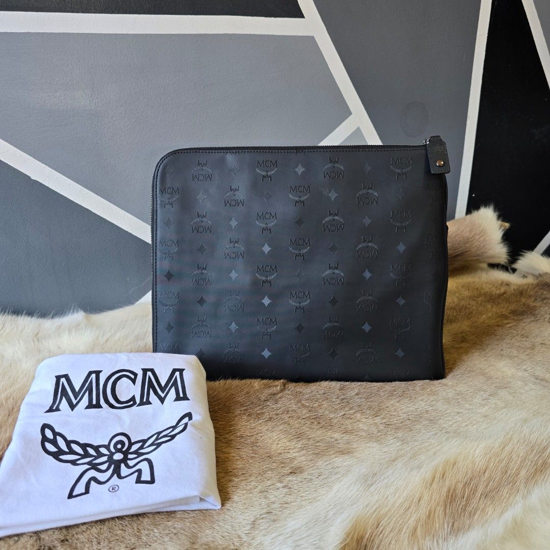 Limited edition MCM studed clutch (Category: Luxury Bags & Wallets) located in Manila. Submitted by arvinaboab04229 (Listing ID 1384543326, Image 2). Description: preloved item super nice in actual.