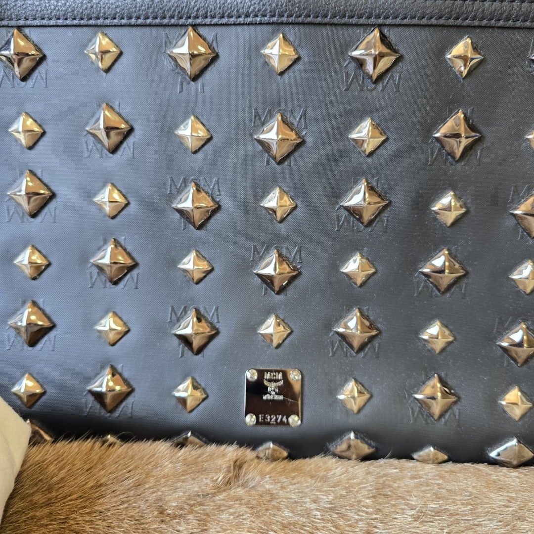 Limited edition MCM studed clutch (Category: Luxury Bags & Wallets) located in Manila. Submitted by arvinaboab04229 (Listing ID 1384543326, Image 3). Description: preloved item super nice in actual.