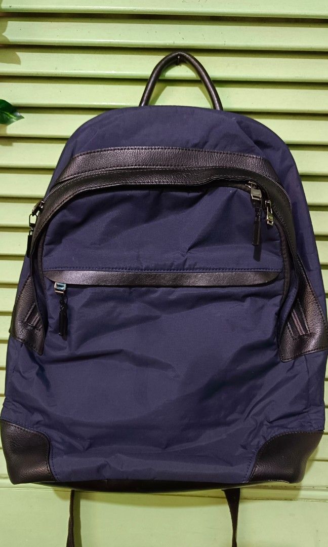 TUMI HAYDON STANFORD BACKPACK (Category: Backpacks) located in Hermosa. Submitted by meowmingZ (Listing ID 1384496453, Image 2). Description: AUTHENTIC Color: Navy Blue Used only once and was stored eversince. Padded/adjustable back straps, Zip entry to main compartment, Leather carry handle, 1 front U-zip pocket, 1 front straight zip pocket, 1 back slip pocket with magnetic closure 2 zip pockets, 2 open pockets, 1 iPad compartment, 15 laptop poc