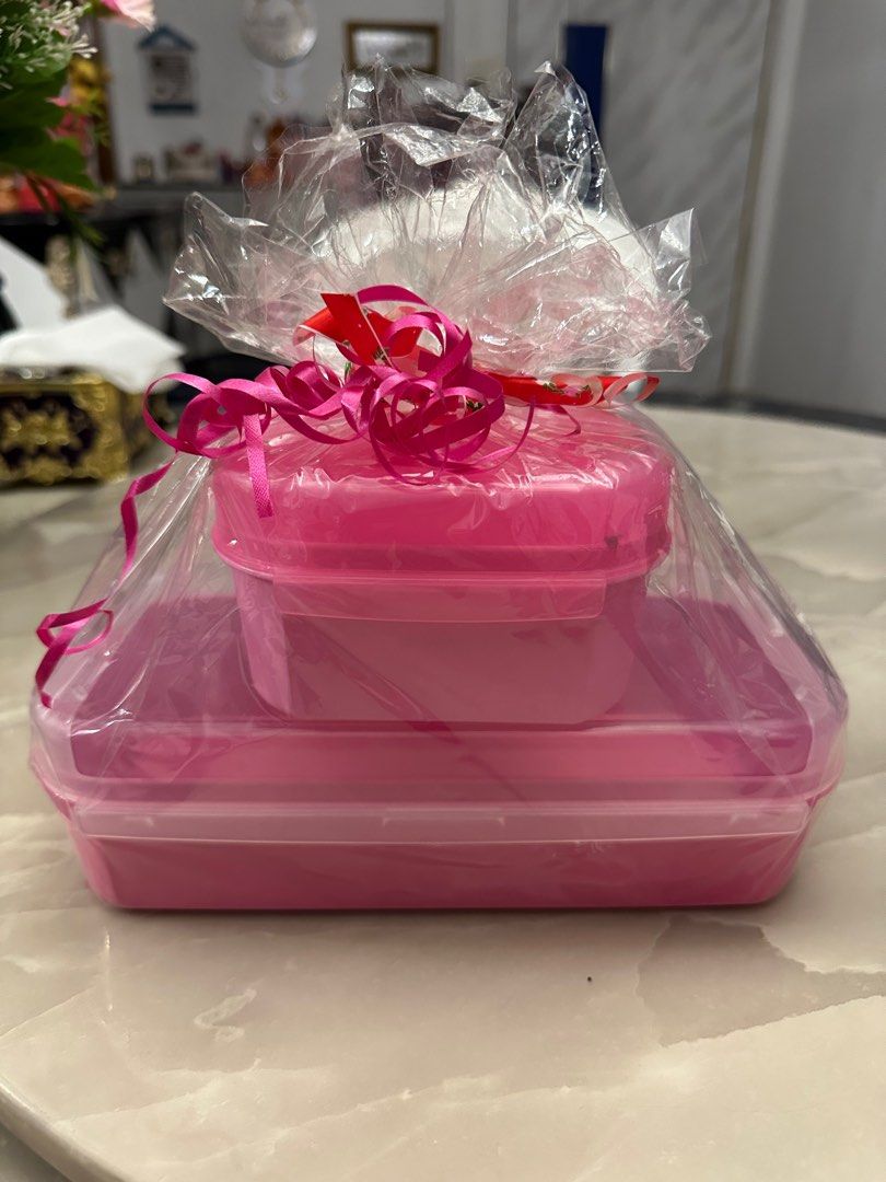 Tupperware Container (Category: Other Kitchenware & Tableware) located in Singapore. Submitted by ngkg12 (Listing ID 1384616735, Image 1). Description: Tupperware Container Rectangle Container 22cmx10cmx7cm Square Container 11cmx11cmx6cm.