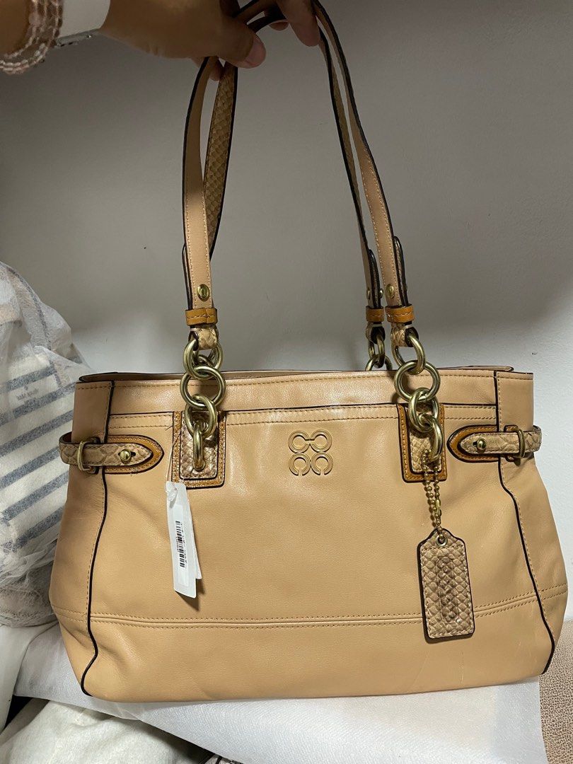 Authentic Coach Colette carryall tote (Category: Luxury Bags & Wallets) located in Guiguinto. Submitted by prelovedinc2024 (Listing ID 1389770084, Image 1). Description: guaranteed authentic, bought in Japan with signs of use - pressmarks and discoloration/color transfer, dirt/stains inside, faded gold hardwares 3compartment size: approx 14x8.5x5” code: 16460.