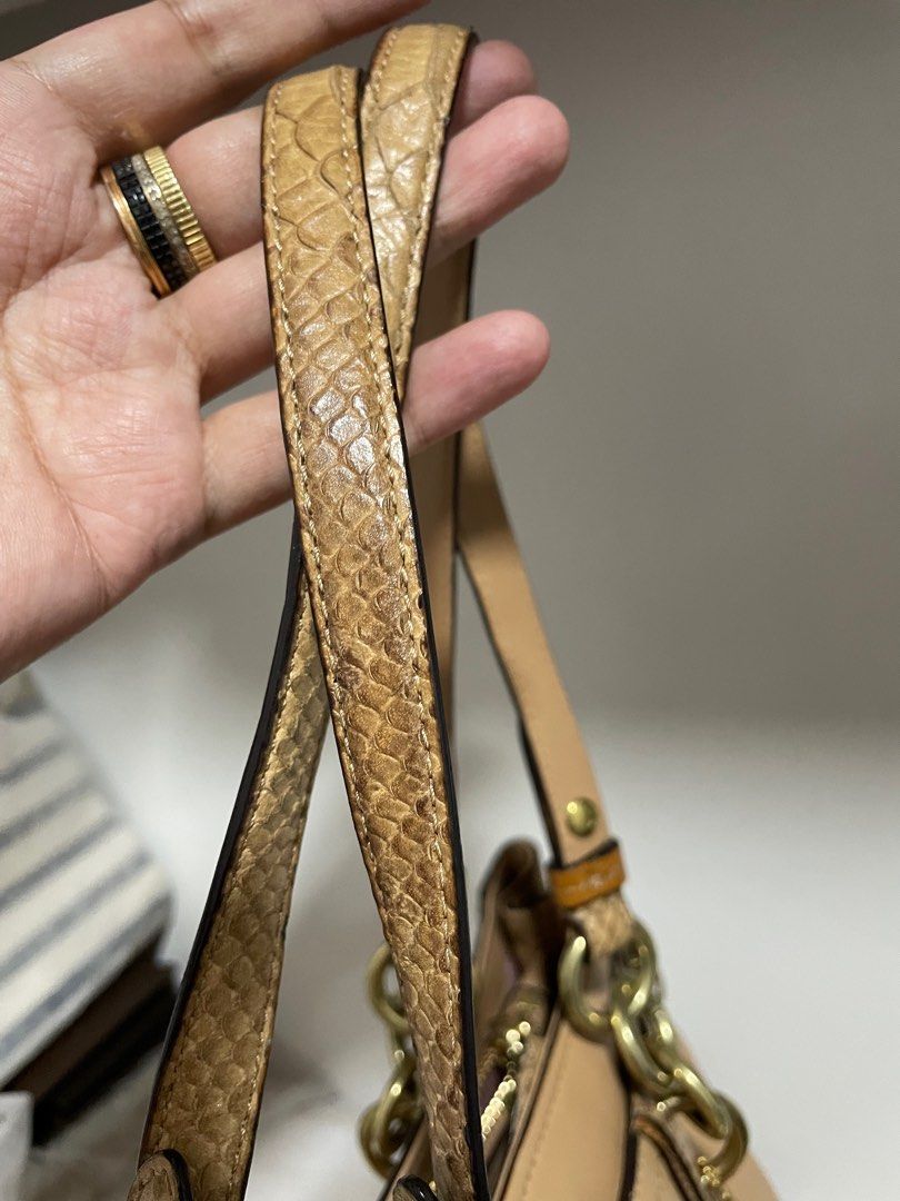 Authentic Coach Colette carryall tote (Category: Luxury Bags & Wallets) located in Guiguinto. Submitted by prelovedinc2024 (Listing ID 1389770084, Image 2). Description: guaranteed authentic, bought in Japan with signs of use - pressmarks and discoloration/color transfer, dirt/stains inside, faded gold hardwares 3compartment size: approx 14x8.5x5” code: 16460.